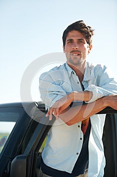 Freedom, portrait and man in car on road trip at door, travel and desert adventure for summer vacation. Transport