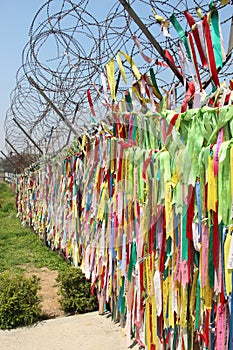 Freedom ribbons tied to a barbed wire fence in the demilitarised zone on the border between South and North Korea