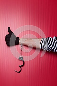 Freedom - robber hand with unlocked handcuffs on hand