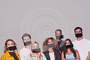 Freedom Of Speech Concept Showing Group Of Young People With Mouths Covered With Tape