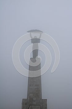 Freedom Staute in fog photo