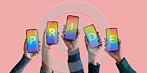 Freedom to Expression for LGTBQ Concept. Group of Diversity People showing Pride Text on Rainbow Color inside a Smartphone photo