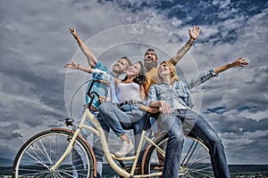 Freedom urban commuting. Bicycle as part of life. Company stylish young people spend leisure outdoors sky background