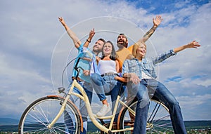 Freedom urban commuting. Company stylish young people spend leisure outdoors sky background. Bicycle as part of life