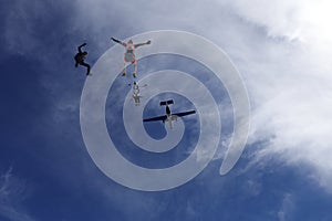 Freefly skydiving. A group of skydivers is in the sky.