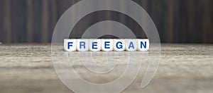 Freegan boggle word cubes on dark background