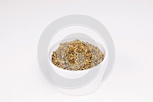 Freekeh in a ramekin in white background