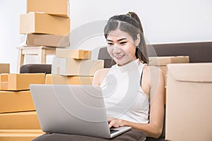Freelance asian woman typing computer
