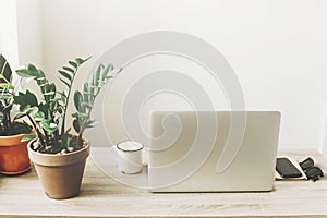 Freelance concept. Desktop with laptop, phone, notebook, coffee