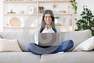 Freelance Concept. Smiling Korean Girl Working Online On Laptop At Home