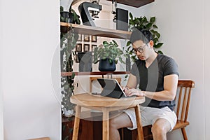 Freelance man working on his tablet in the cafe.