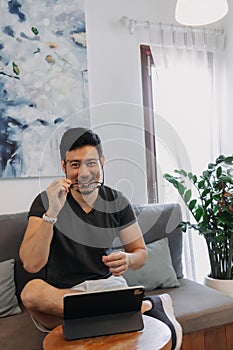 Freelance man working online in the cafe with his tablet.