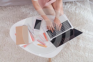 Freelance woman entrepreneur SME seller typing on laptop computer noting the order. Online selling