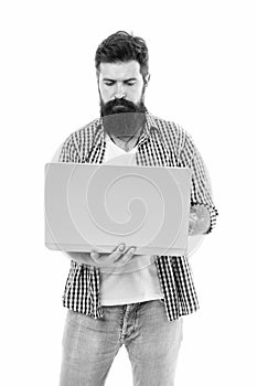 Freelance work online. Bearded man freelancer work on laptop. Man freelancer with laptop. Bearded man using laptop. Busy