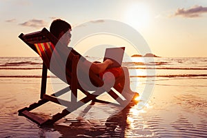 Freelancer business man working on computer in beach office, freelance job