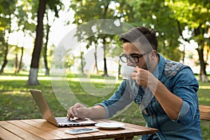 Freelancer hipster man drinking coffee