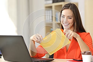 Freelancer opening a padded envelope