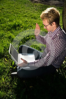 Freelancer is talking on a video conference call on a laptop. Online Meeting Concept