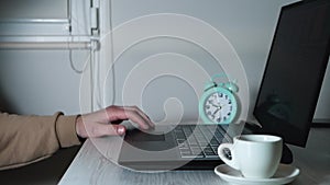 Freelancer tapping his hand on the keyboard, online worker in the office. Working at home