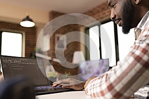 IT freelancer working on app development in home office