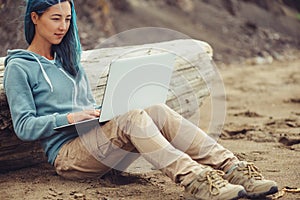 Freelancer working on laptop outdoor