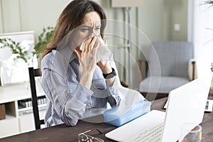 Freelancer young woman suffering from cold