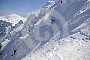 Freeride skiing in high mountains photo