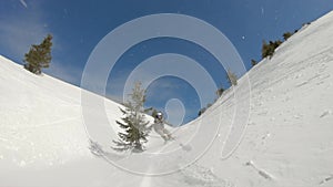 Freeride snowboarding. Riding in backcountry powder snow