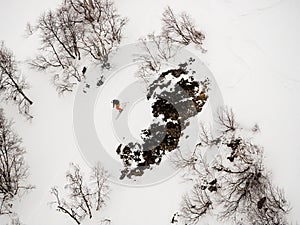 Freerider skier lost his balance and fell into the snow during the descent