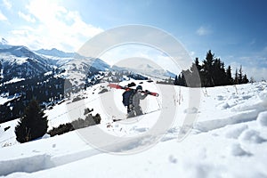 Freerider skier walking in the snow to the waist