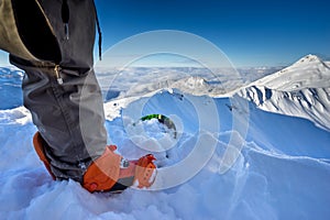 Freerider snowboarder standing on the mountain slope