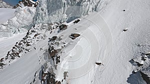 Freestyle close to mountain glacier ice structure snow winter sunny valley cliff