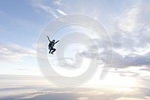 Freestyle skydiving. Girl is flying in the sky.