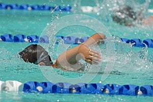 Freestyle swimmer ahead of the competitor