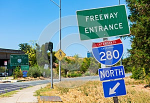 Freeway 280 entrance sign, turned off ramp meter sign, pedestrian crossing sign next to freeway on ramp