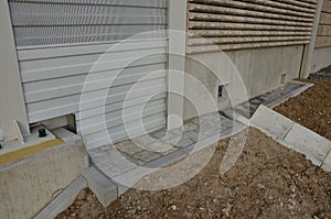 freeway bridge drainage. A sound-absorbing wall with holes lets water