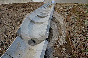 freeway bridge drainage. A sound-absorbing wall with holes lets water