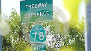 Freeway entrance sign on interchange crossraod in San Diego county, California USA. State Route highway 78 signpost plate. Symbol