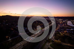 the freeway has many cars going through it in the evening