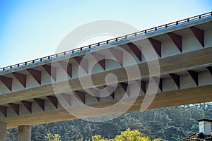 Freeway or highway overpass in suburban area of california with red accent design metal plates triangular with urban