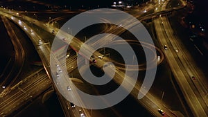 Freeway interchange at night aerial view.