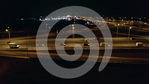 Freeway interchange at night aerial view.