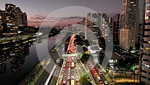 Freeway Traffic At City Sunset In Sao Paulo Brazil.