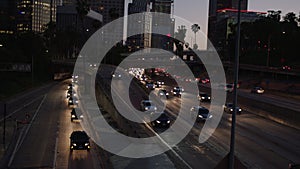 Freeway traffic in downtown Los Angeles at night. Evening Rush Hour Traffic. 4K