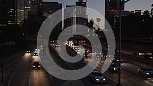 Freeway traffic in downtown Los Angeles at night. Evening Rush Hour Traffic. 4K