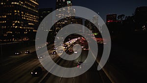 Freeway traffic in downtown Los Angeles at night. Evening Rush Hour Traffic. 4K