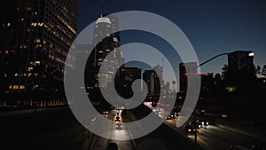 Freeway traffic in downtown Los Angeles at night. Evening Rush Hour Traffic. 4K