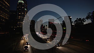 Freeway traffic in downtown Los Angeles at night. Evening Rush Hour Traffic. 4K