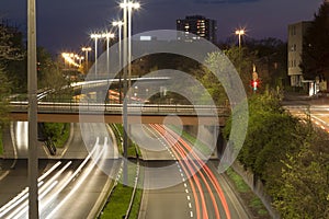 Freeway with urban night traffic with focusing on the road. Car