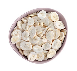 Freeze dried bananas in bowl on white background, top view